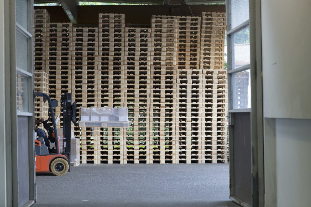 Factory worker using forklift truck