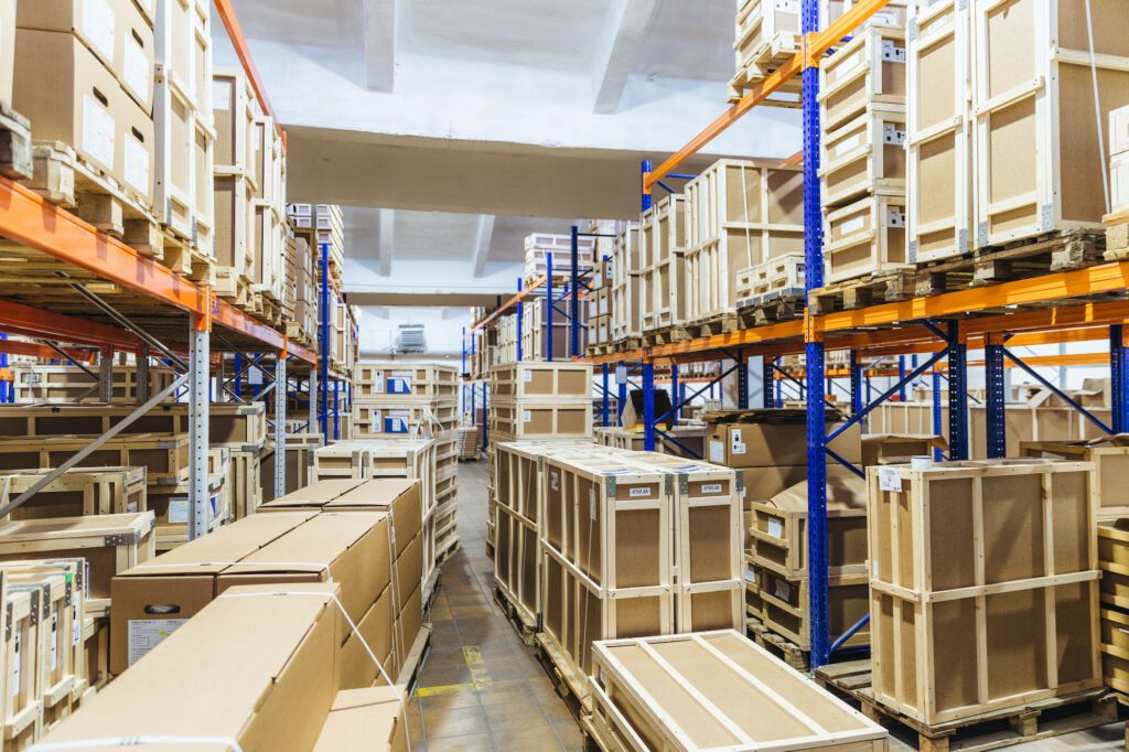 Logistic and distribution warehouse. Empty warehouse full of cargo. Cardboard boxes