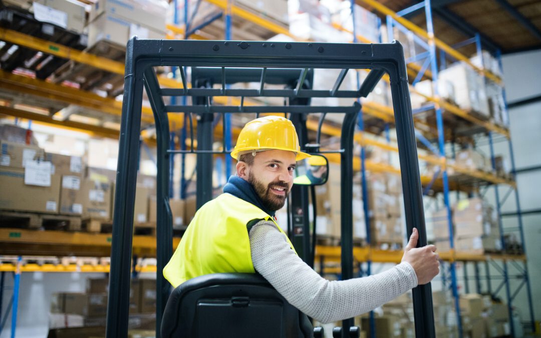 Warehouse man worker with forklift.